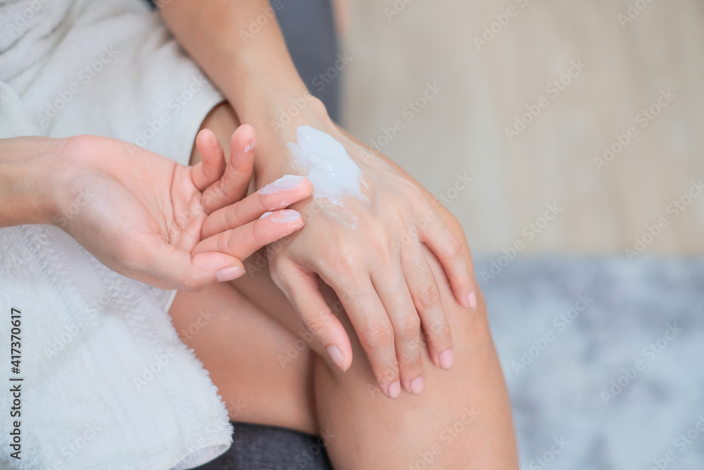 Woman applying natural cream, Woman moisturizing her hand with cosmetic cream, Spa and Manicure concept. Woman applying natural cream, Woman moisturizing her hand with cosmetic cream, Spa and Manicure concept.