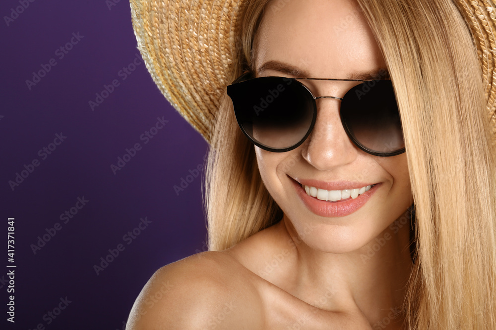 Beautiful woman in stylish sunglasses on purple background, closeup Beautiful woman in stylish sunglasses on purple background, closeup