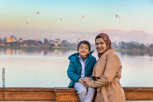 small family enjoying with the Nile river and the Egyptian civilization in Luxor ,Egypt
