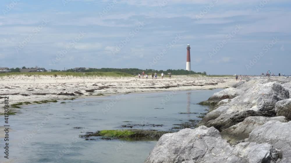 People enjoying the rocky jetty at the Barnegat Lighthouse. People enjoying the rocky jetty at the Barnegat Lighthouse.