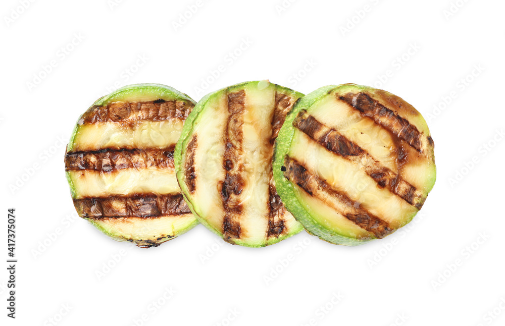Delicious grilled zucchini slices on white background, top view