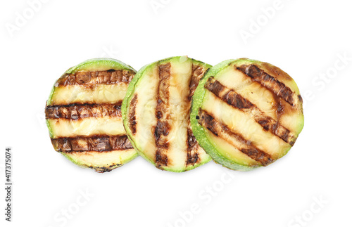 Delicious grilled zucchini slices on white background, top view