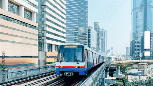 skytrain mass transit with cityscape. photo