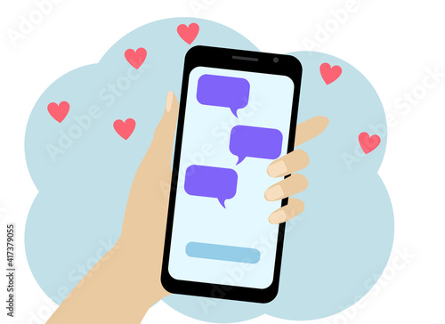 Hand with a mobile phone. In the phone SMS with a declaration of love.