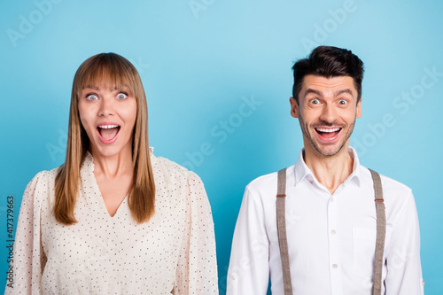 Photo of sweet pretty two persons dressed white clothes big eyes open mouth isolated blue color background