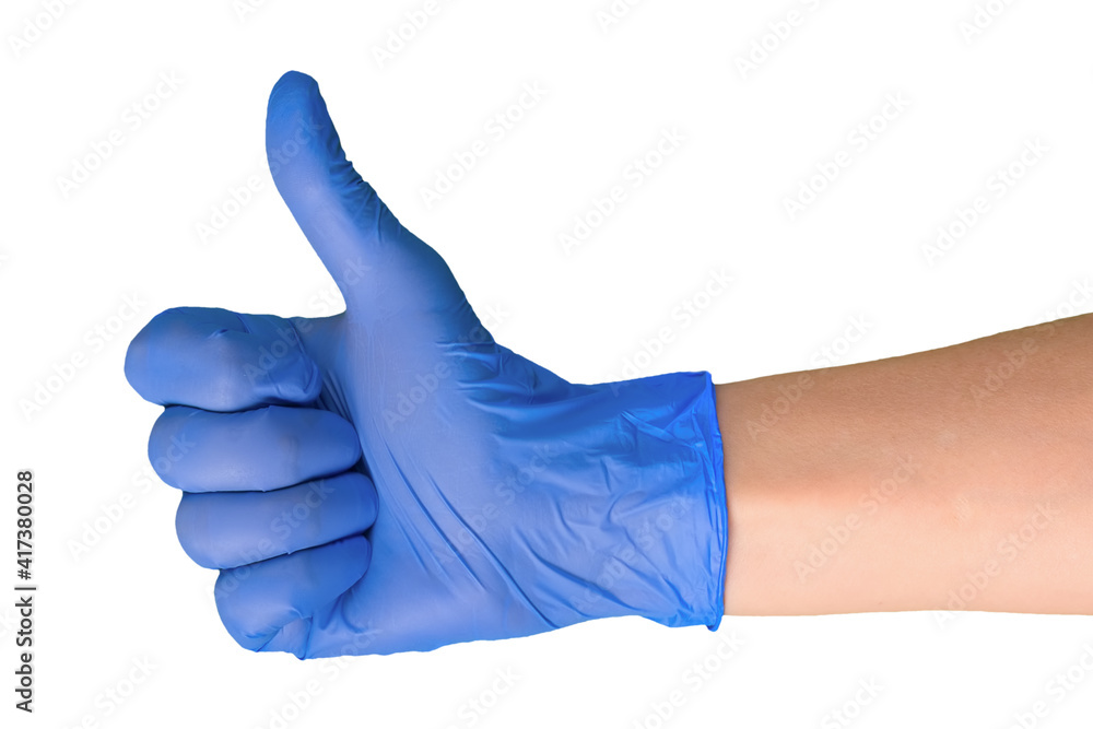 Close-up of a doctor's hand in a medical glove shows a raised thumb gesture. Isolated on white background. .. Close-up of a doctor's hand in a medical glove shows a raised thumb gesture. Isolated on white background. ..