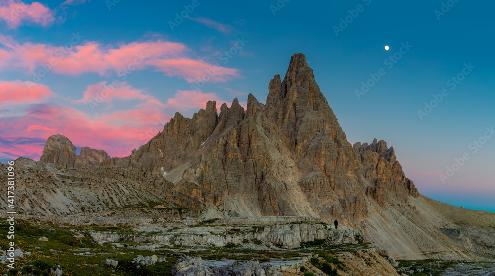 Panoramic landscape of Alps. Tre Cime di Lavaredo at night with real moon