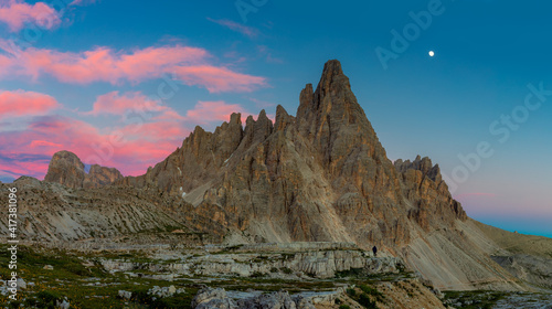 Panoramic landscape of Alps. Tre Cime di Lavaredo at night with real moon