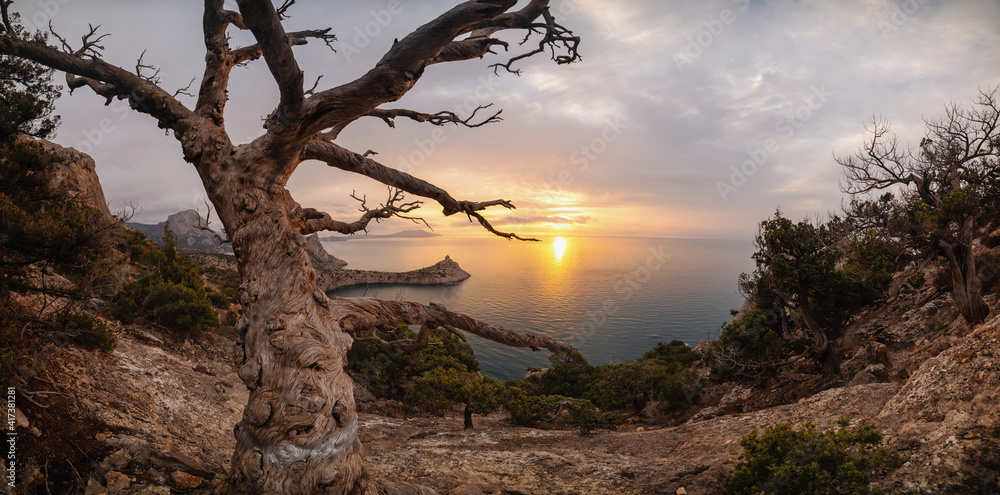Beautiful sunrise in the rocky mountains on the coast Beautiful sunrise in the rocky mountains on the coast