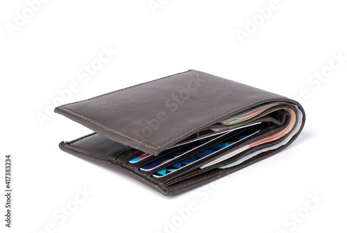 Sideview isolated of Brown leather Money wallet with banknote and credit card on white background.
