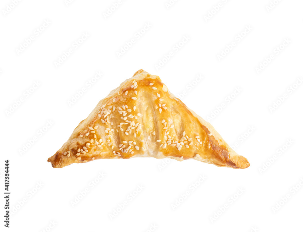 Delicious puff with ham and cheese on a white plate, isolate. Crispy bun on yeast puff pastry Delicious puff with ham and cheese on a white plate, isolate. Crispy bun on yeast puff pastry