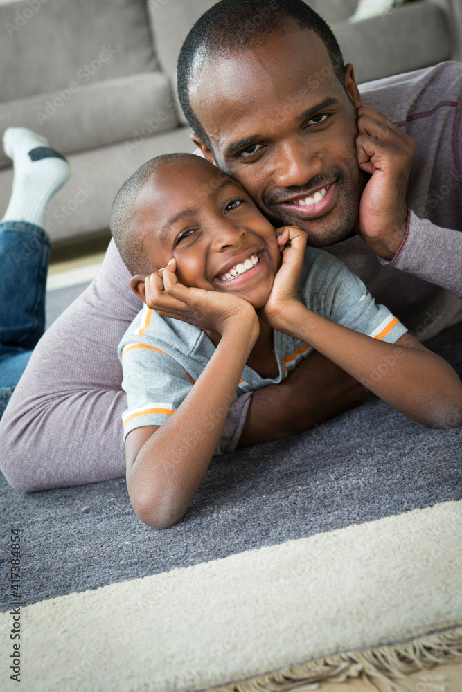 Father and son lying on floor Father and son lying on floor