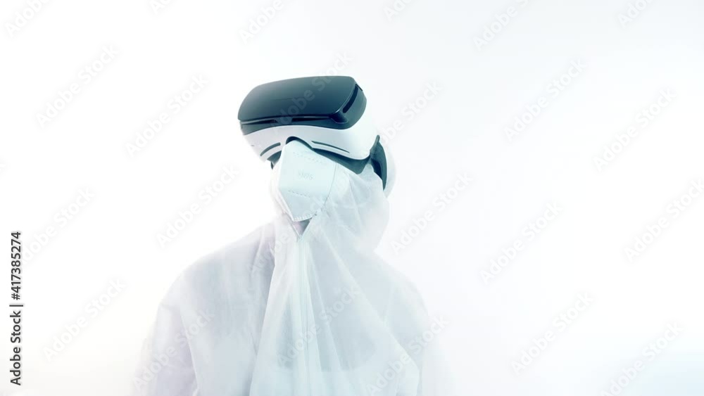 Virologist in full protective suit using vr glasses in research Virologist in full protective suit using vr glasses in research