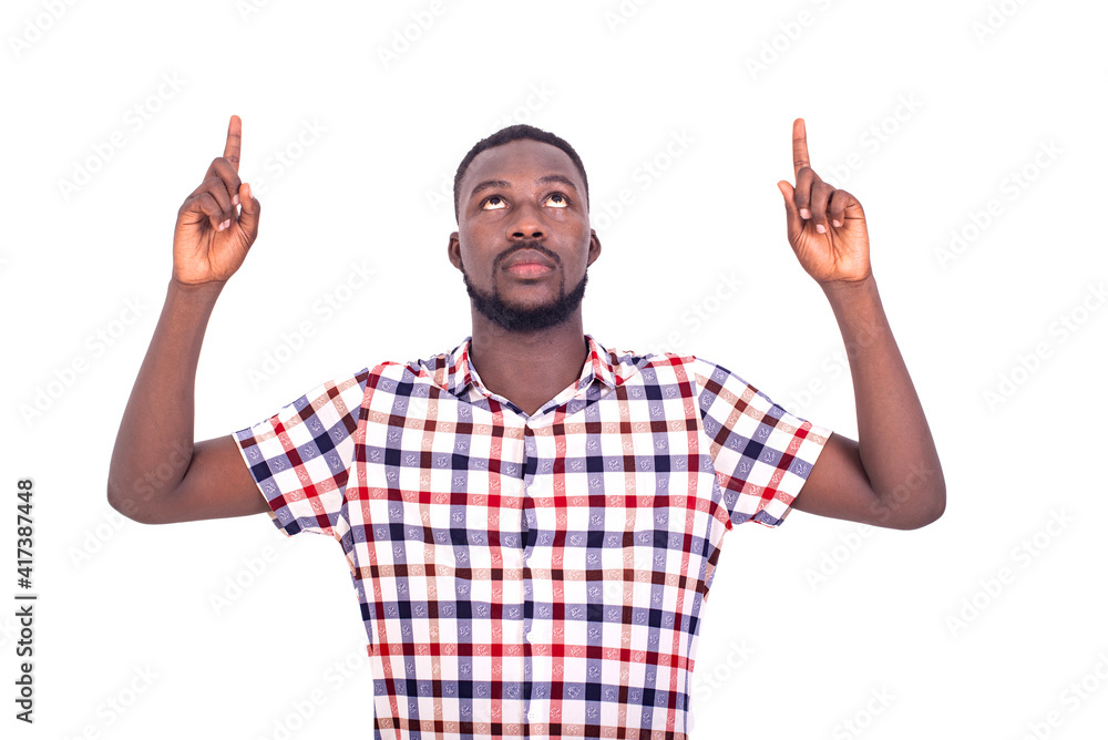 handsome serious adult man standing and pointing finger up. handsome serious adult man standing and pointing finger up.