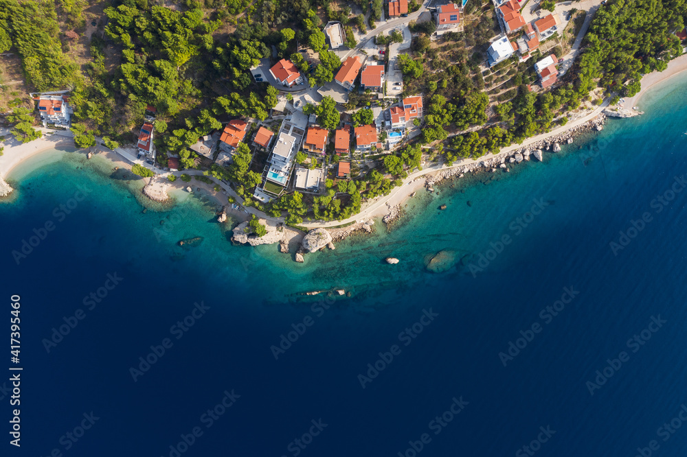 Famous Adriatic coast. Panoramic aerial view of picturesque coastline in Makarska riviera, Brela, Croatia, Europe. Top view on splendid Adriatic sea and a village by the sea. Copy space, postcard.