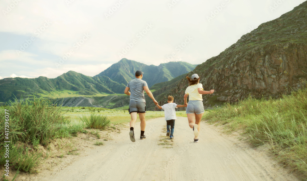family running on the road in countryside