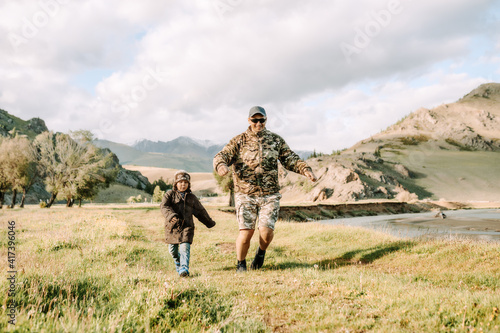 father and son walking in the countryside