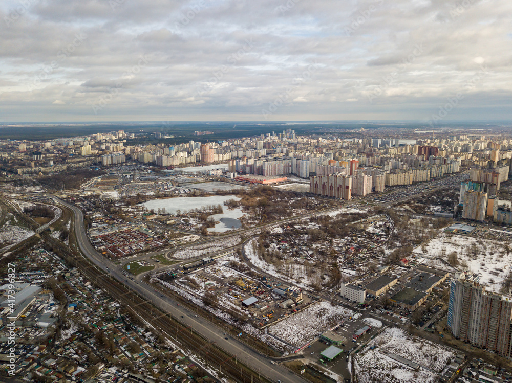 Railway in Kiev city. Aerial drone view. Cloudy winter day.