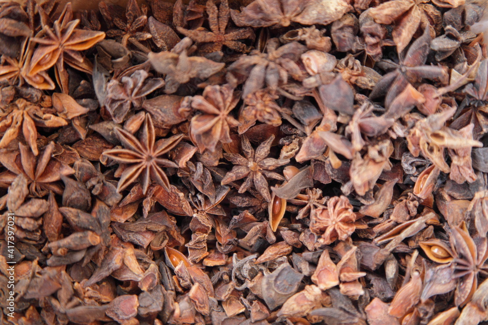 A lot dried Star Anis spices ingredient for food cooking, natural background texture A lot dried Star Anis spices ingredient for food cooking, natural background texture