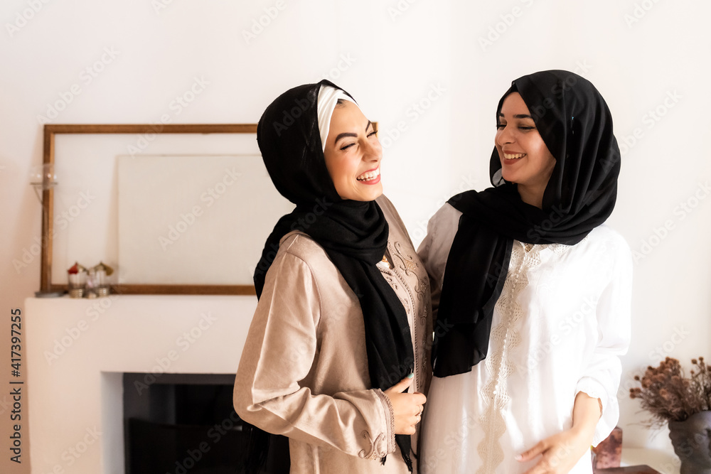 Female friends laughing together Female friends laughing together