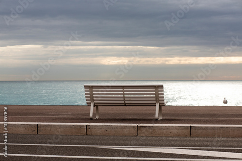 Rear view of bench on beach, Nice, Alpes-Maritimes, France