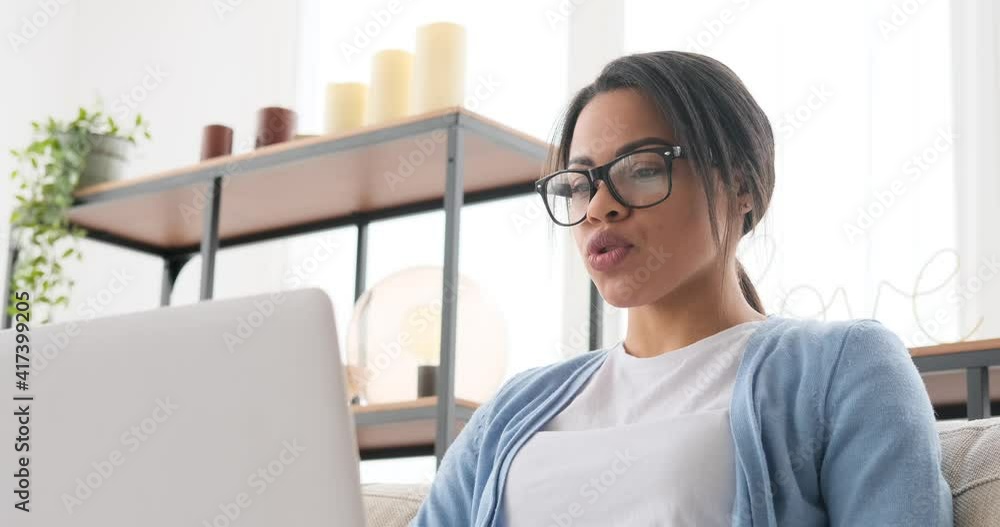 Woman video chatting using laptop at home Woman video chatting using laptop at home