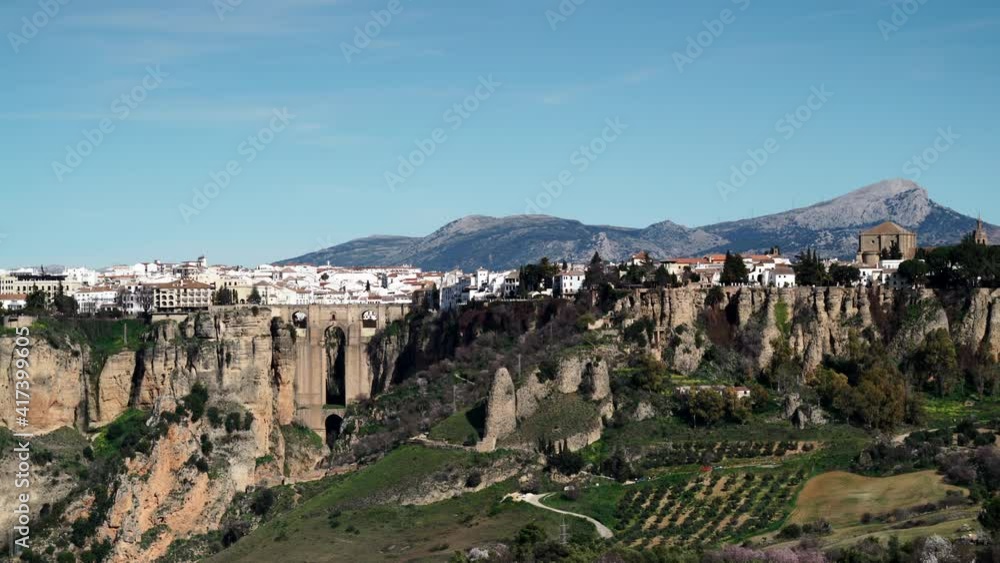 Time lapse of clouds moving over Ronda valley, green fields and town on cliff, mountainous area. Malaga province, Andalusia, Spain. Tourist attraction, place to visit. Time lapse of clouds moving over Ronda valley, green fields and town on cliff, mountainous area. Malaga province, Andalusia, Spain. Tourist attraction, place to visit.