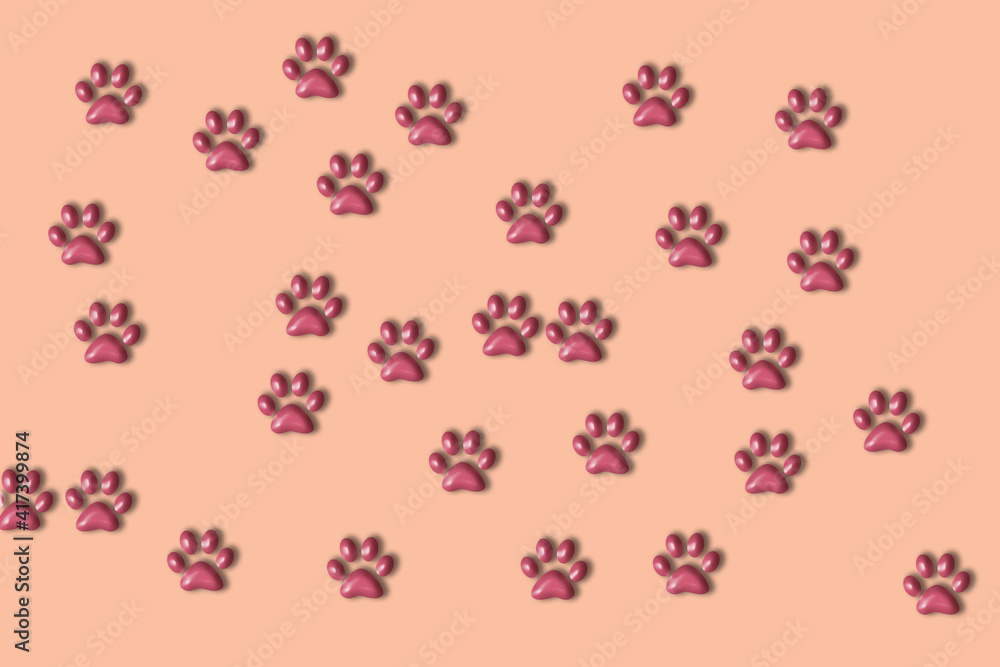 Pink background with paws. Animal care concept with copy  space.