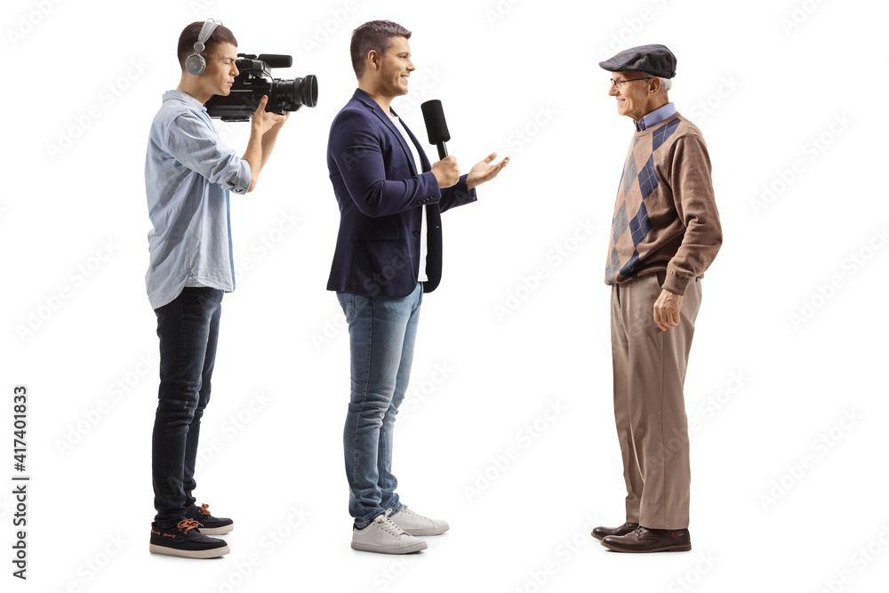 Videographer and a male reporter interviewing an elderly man Videographer and a male reporter interviewing an elderly man