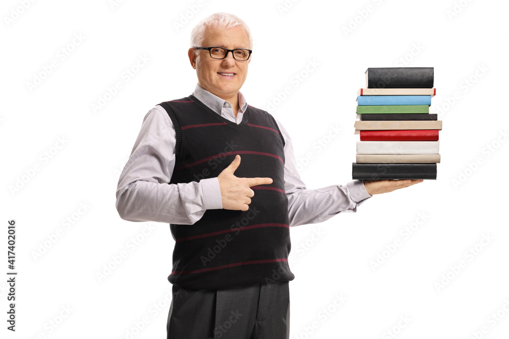 Wise mature man holding a pile of books and pointing