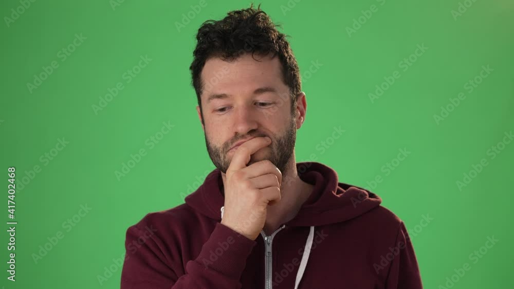 Close up head shot portrait man applicant on green screen chroma key wave hand greeting remote employer hr managers answers questions feels confident during job interview by video call app concept Close up head shot portrait man applicant on green screen chroma key wave hand greeting remote employer hr managers answers questions feels confident during job interview by video call app concept