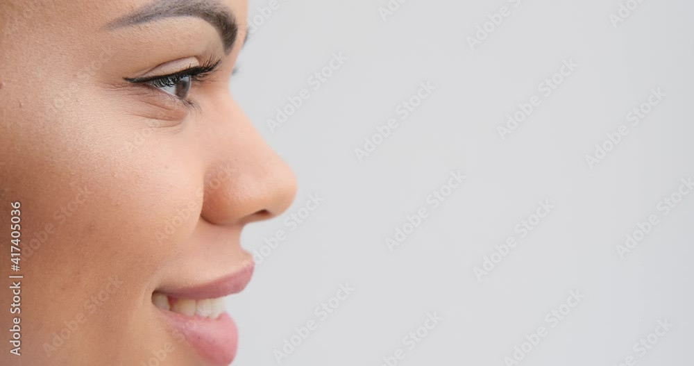 Profile face of beautiful woman smiling over white background Profile face of beautiful woman smiling over white background