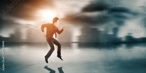 Businessman looks hurry while running on the road