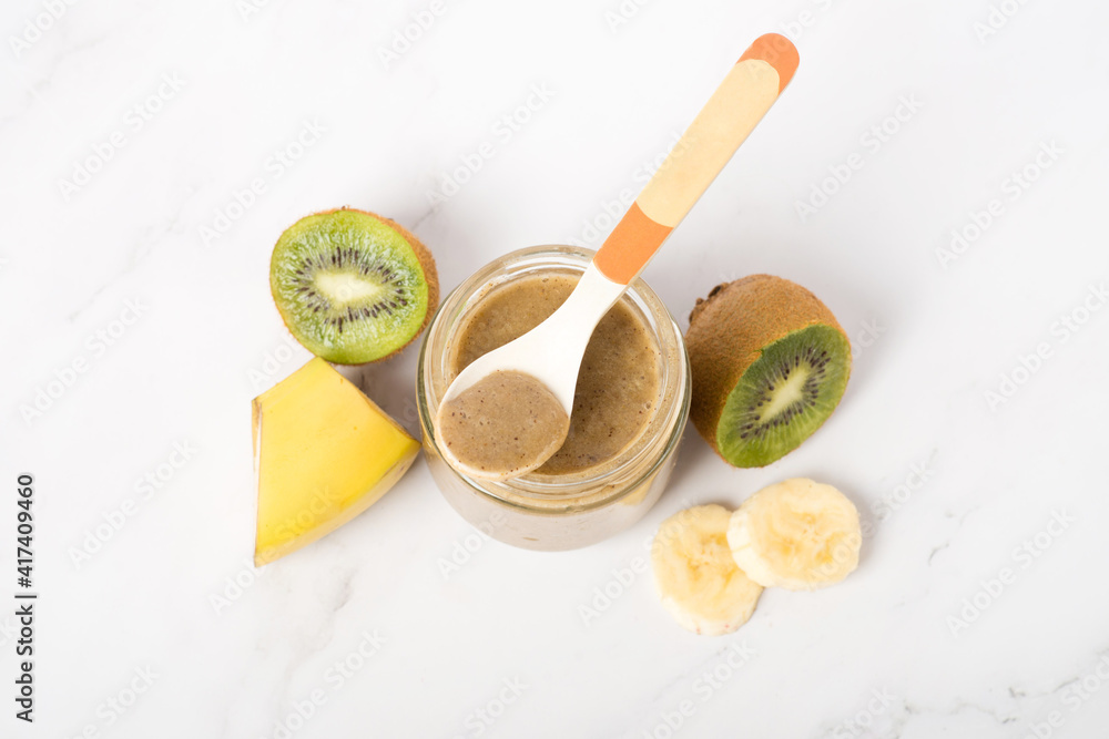 baby food in a jar, banana and kiwi puree baby food in a jar, banana and kiwi puree
