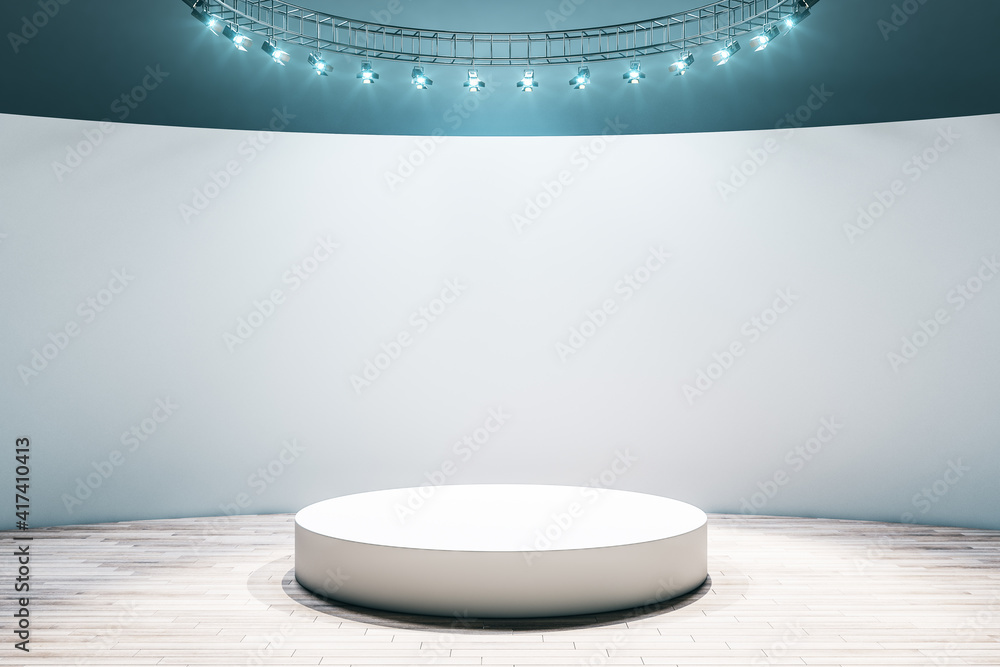 White round podium in the center of empty hall room with parquet floor, light wall and led light on top. Mock up