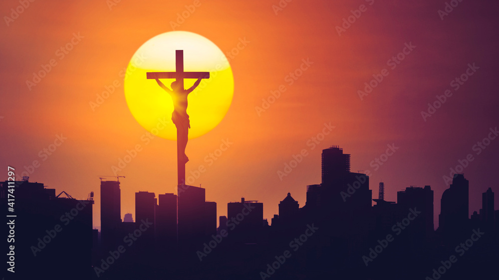 Christian cross with silhouette of skyscrapers