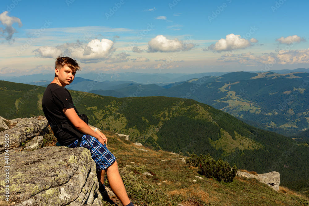Naklejka premium Tourists and mountains of the Montenegrin ridge, endless landscapes and the silence of the mountains.
