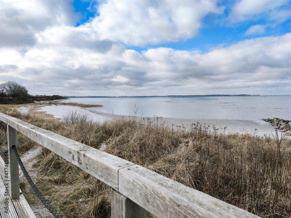 Naklejka premium Photo of wooden pier with observation deck entering the sea in north Germany on Baltic sea