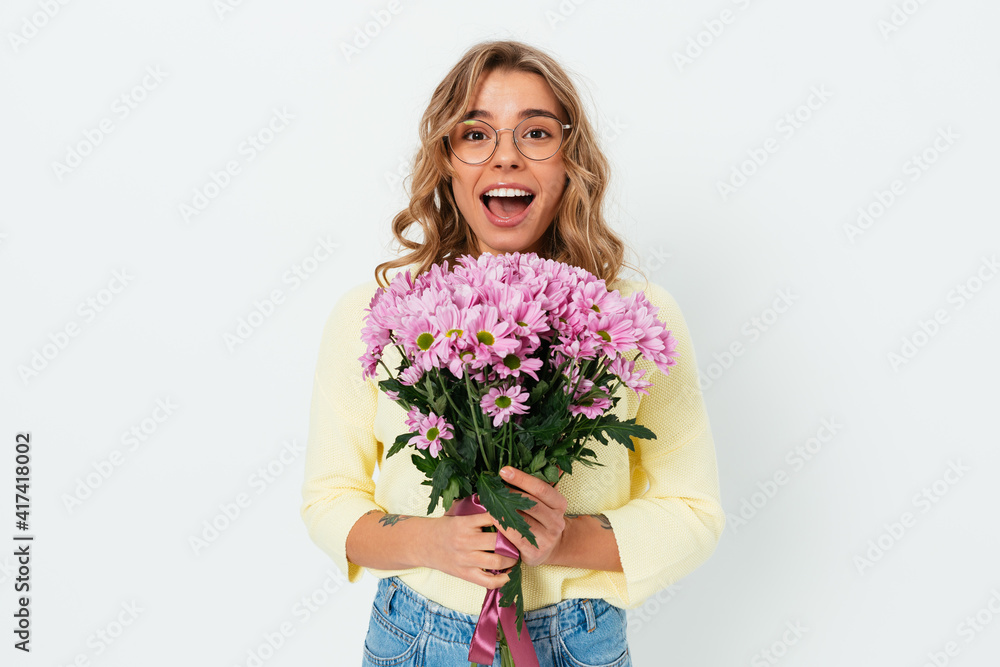 Excited young woman received flowers