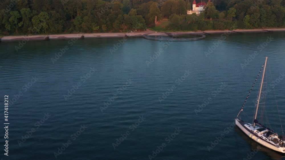 Ocean Waters and the Infinite Bridge by the Coast Against Forest Trees Ocean Waters and the Infinite Bridge by the Coast Against Forest Trees
