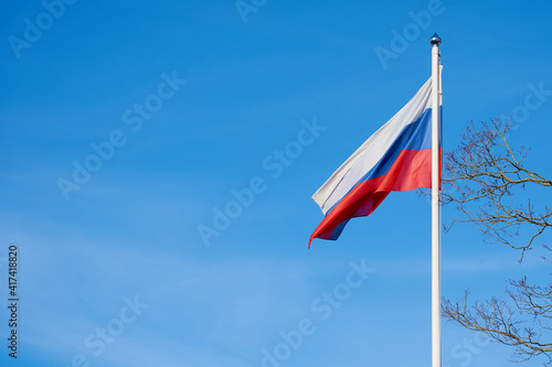 Russian flag on sky background