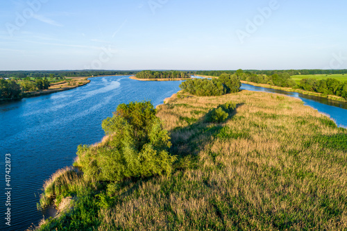 A river of blue water and several islands photographed late The golden hour.