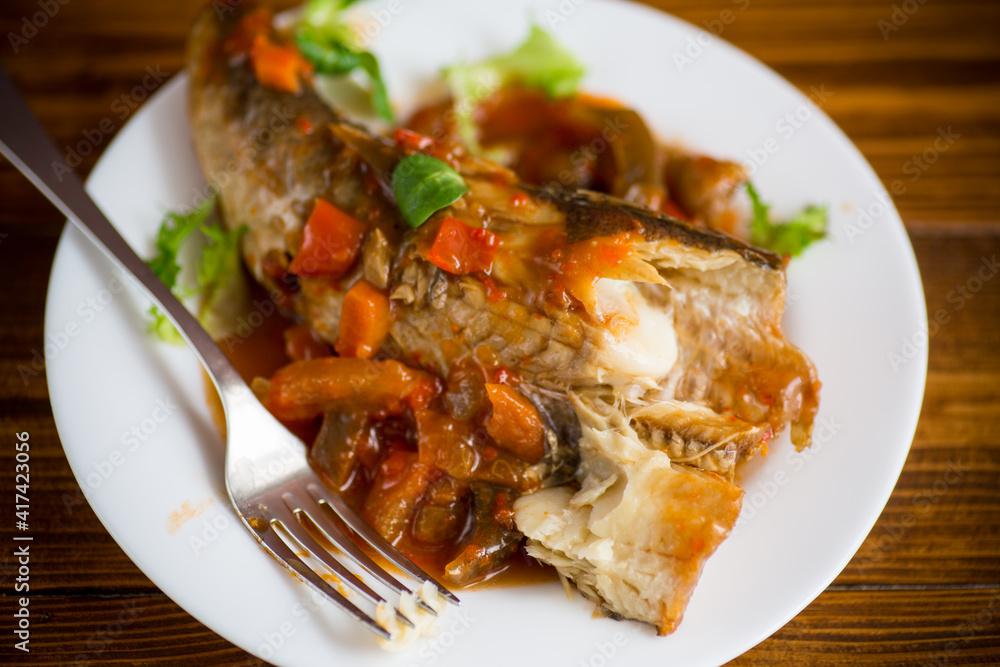 whole fish hake stewed with carrots, beets, peppers and other whole fish hake stewed with carrots, beets, peppers and other