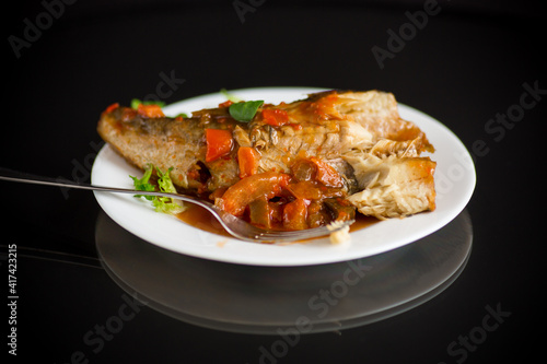whole fish hake stewed with carrots, beets, peppers and other