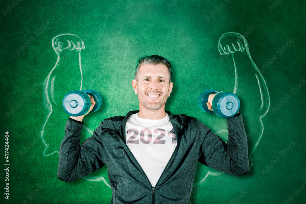 Man hold dumbbells near biceps and number 2021