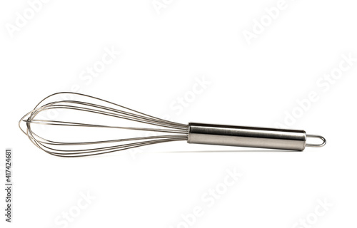Stainless steel whisk isolated on white background.