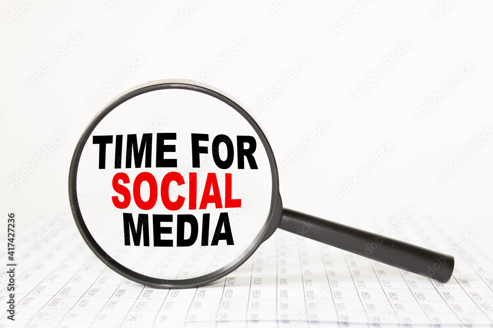 words TIME FOR SOCIAL MEDIA in a magnifying glass on a white background. business concept words TIME FOR SOCIAL MEDIA in a magnifying glass on a white background. business concept
