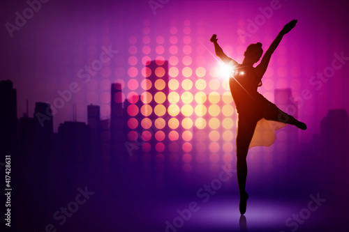 Ballet dancer dancing sparkling lights background