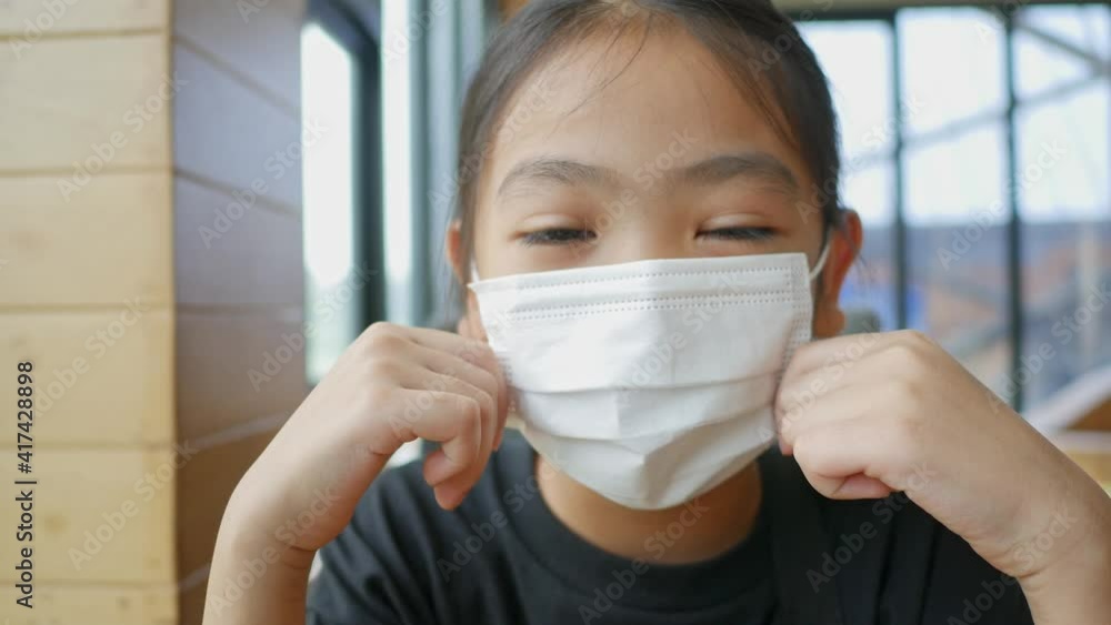 Children wearing dust and vapors mask, He shows wearing a mask and handwashing to prevent COVID-19. Children wearing dust and vapors mask, He shows wearing a mask and handwashing to prevent COVID-19.