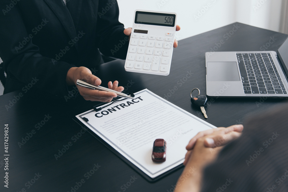 Car salesman offers prices and conditions for buying or renting a car to a customer, Entering into a car purchase-sale agreement with insurance, Way of business people conversation. Car salesman offers prices and conditions for buying or renting a car to a customer, Entering into a car purchase-sale agreement with insurance, Way of business people conversation.
